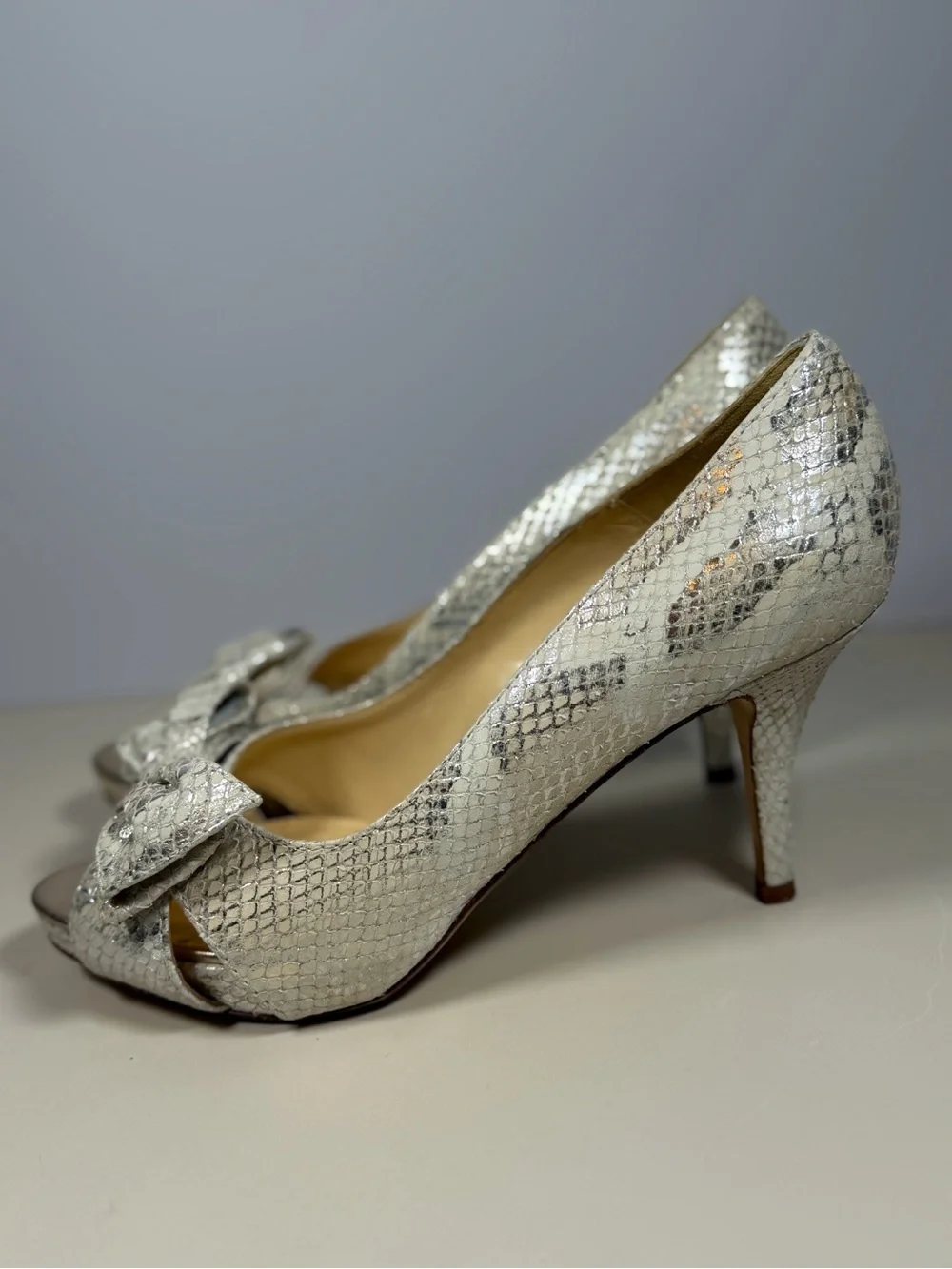 kate spade Silver Snake-Embossed Peep Toe Heels with Bow